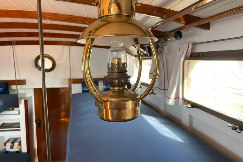 Slide: The Image of Vintage brass lantern inside 1939 Richardson 26 Little Giant boat cabin. - 15