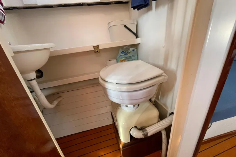 Slide: The Image of Compact 1939 Richardson 26 Little Giant boat bathroom with toilet and sink. - 20