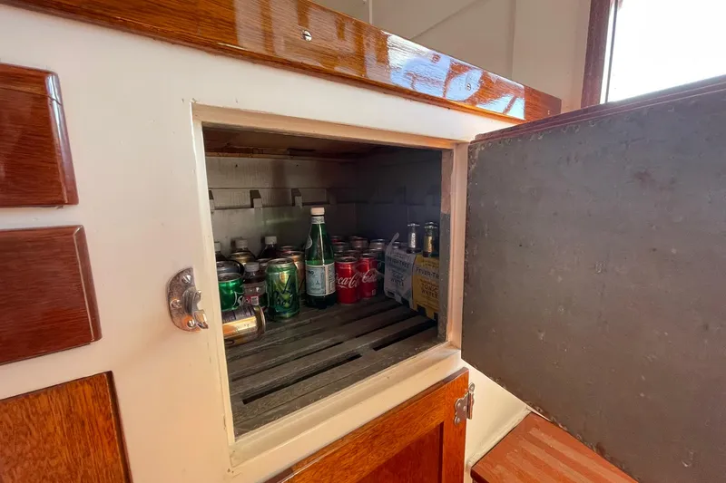 Slide: The Image of Vintage 1939 Richardson 26 Little Giant fridge with assorted drinks inside. - 21