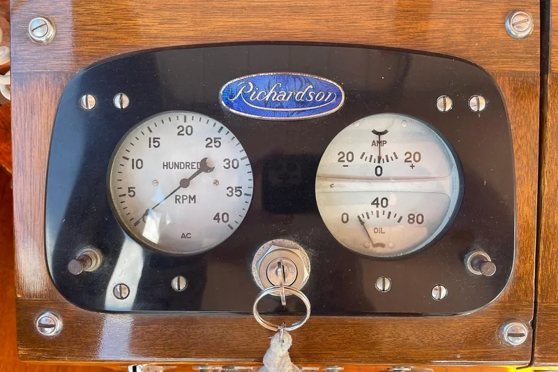 Slide: The Image of Vintage 1939 Richardson 26 Little Giant dashboard with RPM and amp gauges. - 27