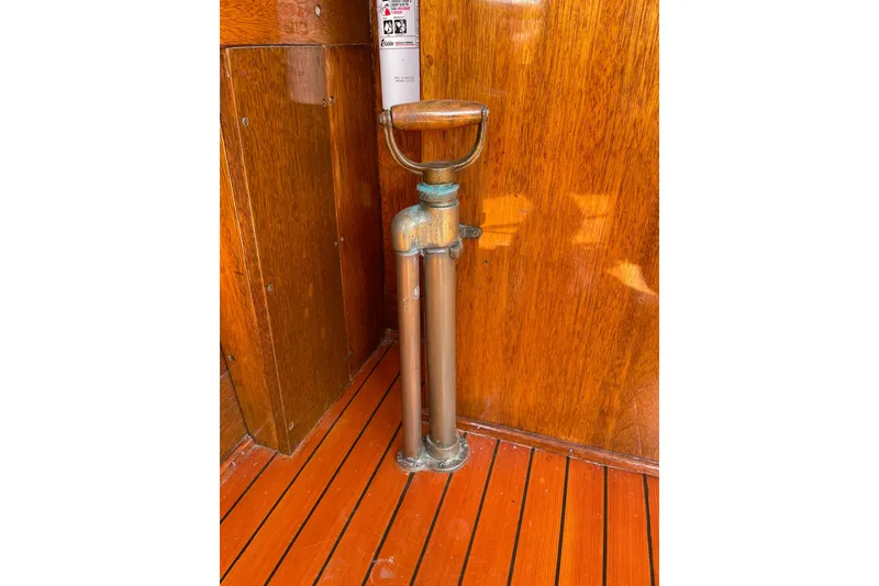 Slide: The Image of Vintage 1939 Richardson 26 Little Giant boat interior with wooden flooring and brass details. - 29