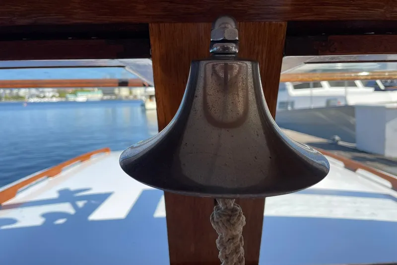 Slide: The Image of Vintage 1939 Richardson 26 Little Giant boat bell with nautical background. - 32