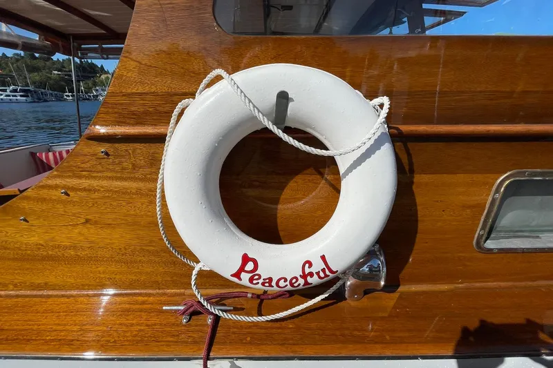 Slide: The Image of Lifebuoy labeled "Peaceful" on 1939 Richardson 26 Little Giant boat. - 38