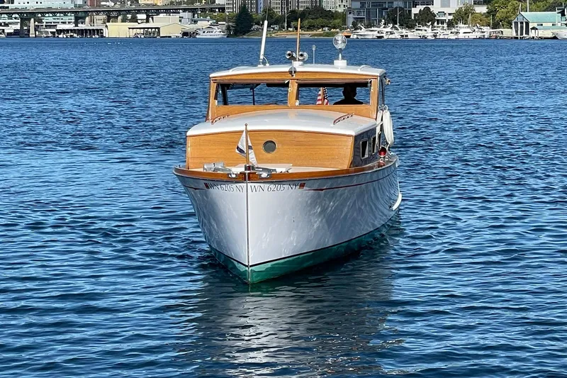 Slide: The Image of Vintage 1939 Richardson 26 Little Giant boat on calm water. - 44