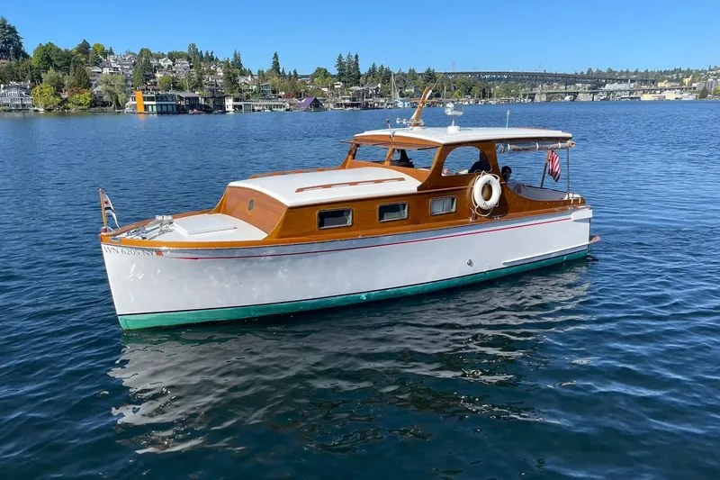 Slide: The Image of Vintage 1939 Richardson 26 Little Giant boat on a serene lake. - 45