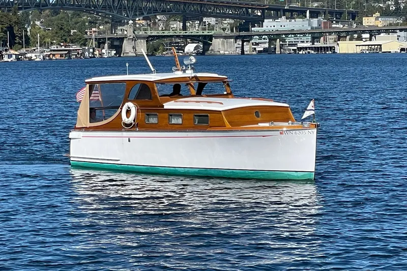 Slide: The Image of Vintage 1939 Richardson 26 Little Giant boat on a scenic waterway. - 46