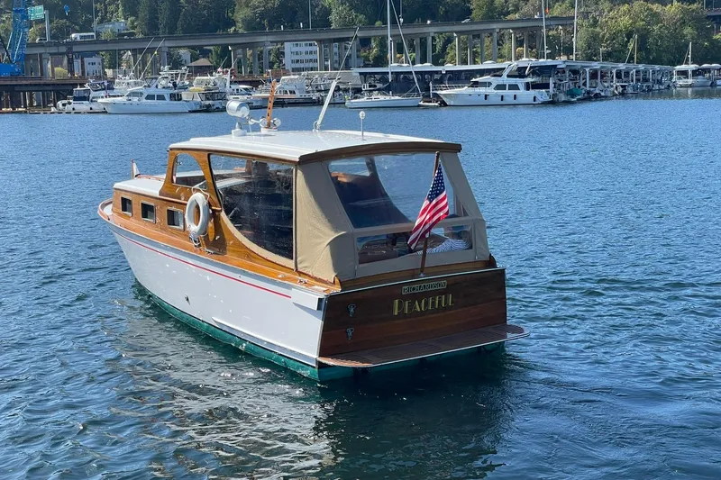 Slide: The Image of Vintage 1939 Richardson 26 Little Giant boat on serene water, American flag displayed. - 47
