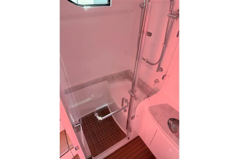 Slide: The Image of Luxurious shower area in 2025 Intrepid 51 Panacea yacht, featuring modern fixtures and elegant design. - 11