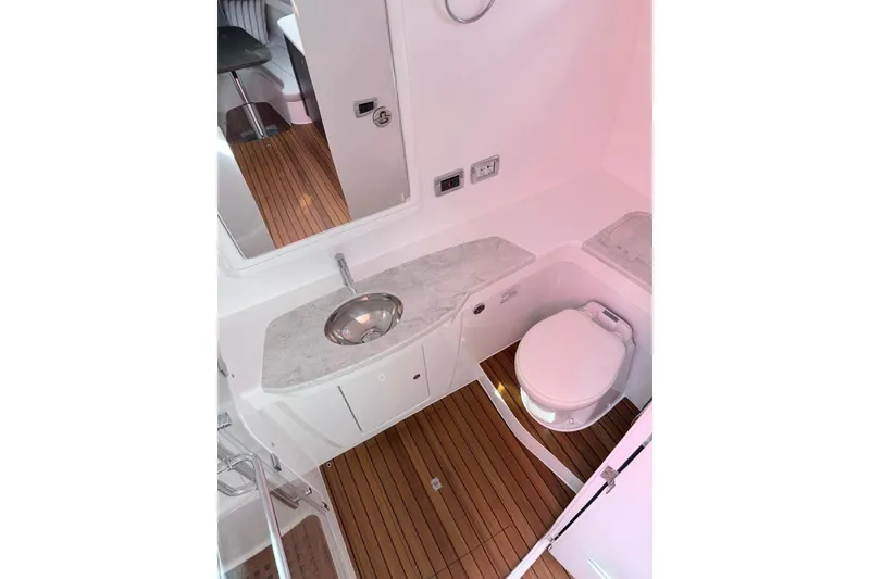 Slide: The Image of Luxurious bathroom in 2025 Intrepid 51 Panacea yacht with modern fixtures and wood flooring. - 12