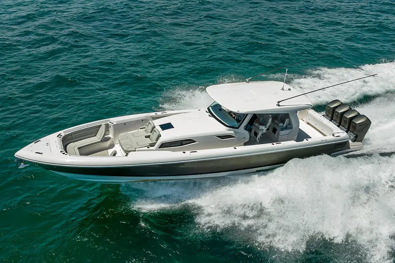 Slide: The Image of Manufacturer Provided Image: 2025 Intrepid 51 Panacea boat cruising on open water. - 16