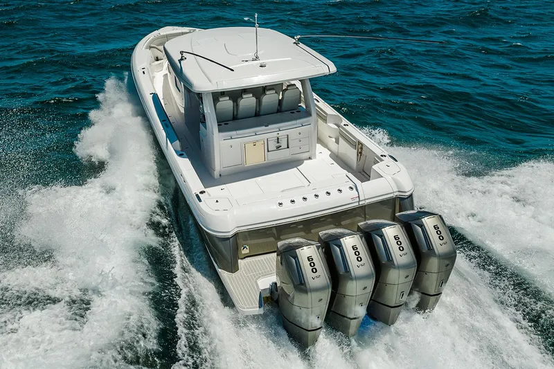 Slide: The Image of Manufacturer Provided Image: 2025 Intrepid 51 Panacea boat with quad engines cruising on the ocean. - 17