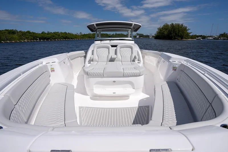 Slide: The Image of Manufacturer Provided Image: 2025 Intrepid 51 Panacea luxury boat with spacious seating on a sunny day. - 19