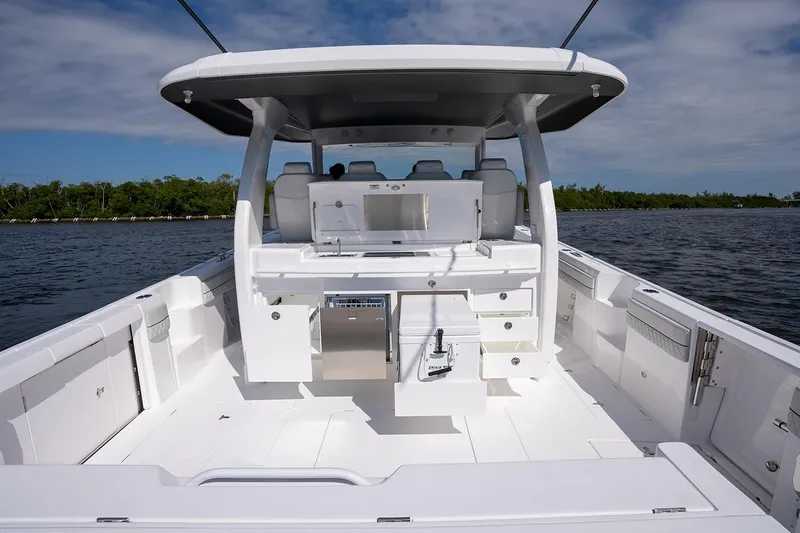 Slide: The Image of Manufacturer Provided Image: 2025 Intrepid 51 Panacea boat interior with sleek white design and modern amenities. - 20