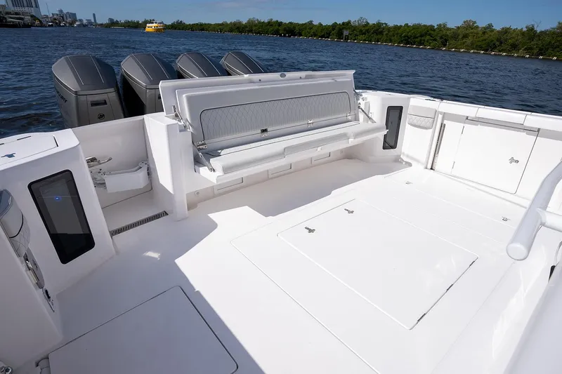 Slide: The Image of Manufacturer Provided Image: 2025 Intrepid 51 Panacea boat deck with seating and storage compartments. - 24