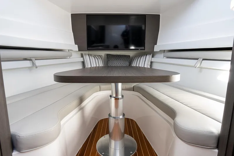 Slide: The Image of Manufacturer Provided Image: Interior of 2025 Intrepid 51 Panacea with modern seating and table. - 28