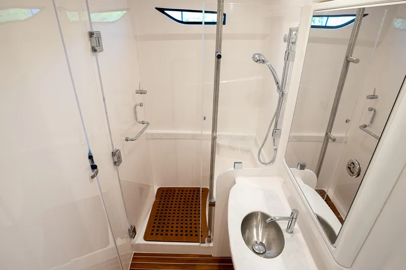 Slide: The Image of Manufacturer Provided Image: Modern bathroom in 2025 Intrepid 51 Panacea yacht with shower and sink. - 29