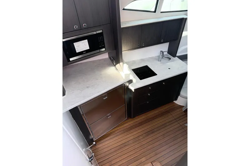 Slide: The Image of Modern kitchen area in 2025 Intrepid 51 Panacea yacht with sleek appliances. - 7