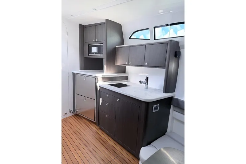 Slide: The Image of Modern kitchen in 2025 Intrepid 51 Panacea yacht with sleek cabinetry and appliances. - 8