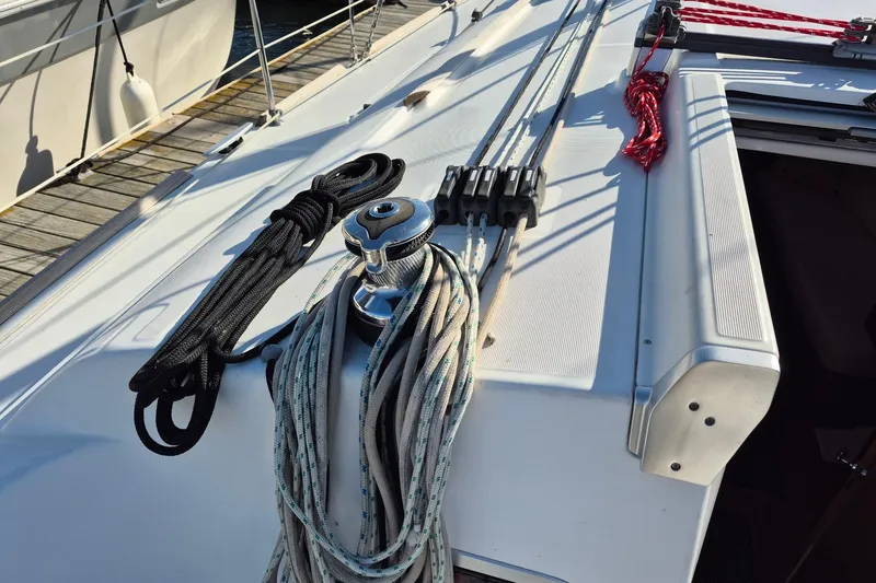 Slide: The Image of Deck of 2011 Beneteau Oceanis 37 sailboat with ropes and winch. - 12