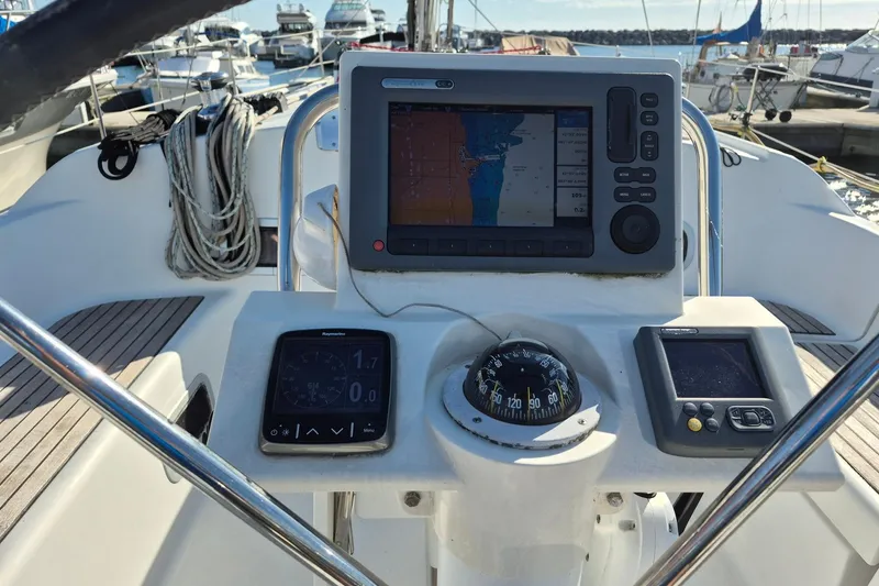 Slide: The Image of Cockpit of 2011 Beneteau Oceanis 37 sailboat with navigation instruments and compass. - 14