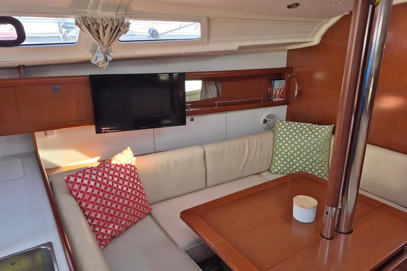 Slide: The Image of Interior of 2011 Beneteau Oceanis 37 yacht with cozy seating and modern amenities. - 24