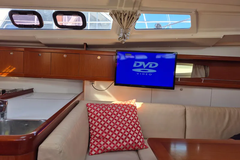 Slide: The Image of Interior of 2011 Beneteau Oceanis 37 yacht with TV and cozy seating area. - 25