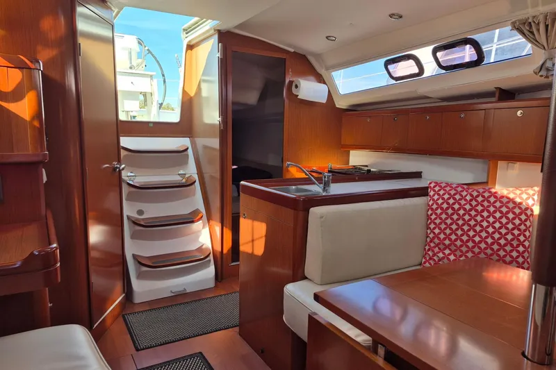 Slide: The Image of Interior of 2011 Beneteau Oceanis 37 yacht with wood finish and modern amenities. - 27