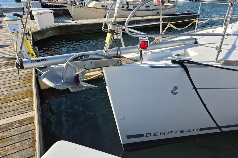 Slide: The Image of 2011 Beneteau Oceanis 37 yacht docked, featuring anchor and Selden equipment. - 3