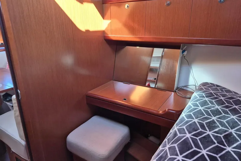 Slide: The Image of Cozy interior of 2011 Beneteau Oceanis 37 yacht with wooden desk and mirror. - 31