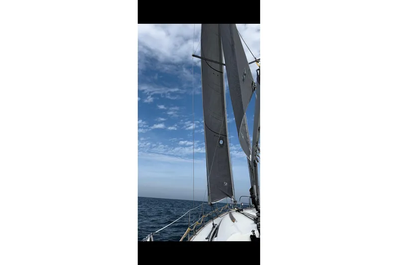 Slide: The Image of Sailing on a 2011 Beneteau Oceanis 37 under clear blue skies. - 40