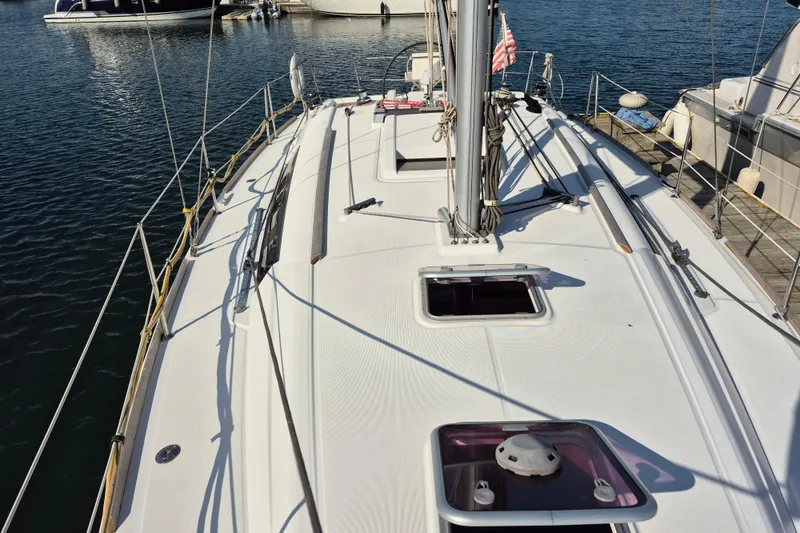 Slide: The Image of 2011 Beneteau Oceanis 37 sailboat deck view at marina. - 6