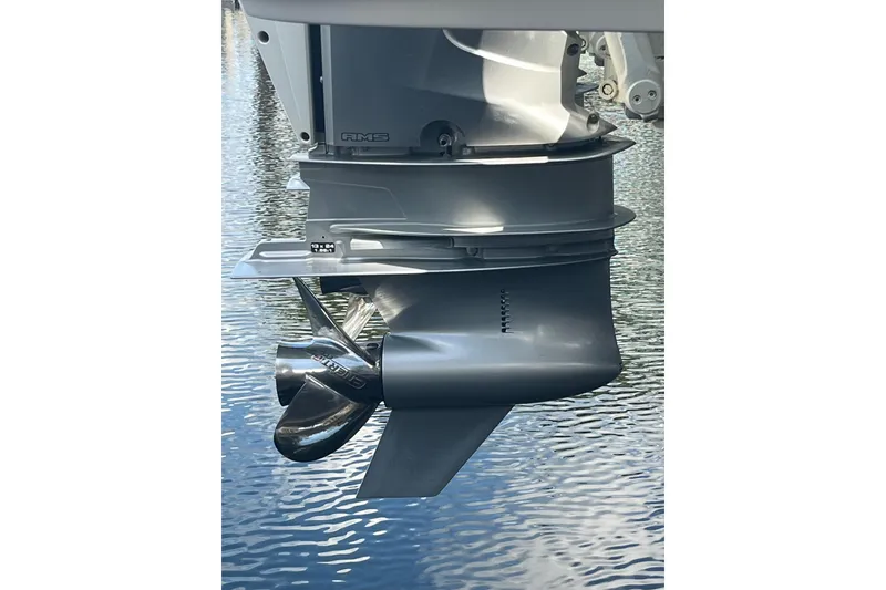 Slide: The Image of Outboard motor of 2021 Axopar 37 Cross Cabin on water. - 12