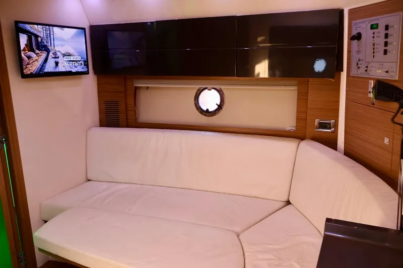 Slide: The Image of Luxurious interior of 2014 Azimut 38 yacht with white sofa and wall-mounted TV. - 16