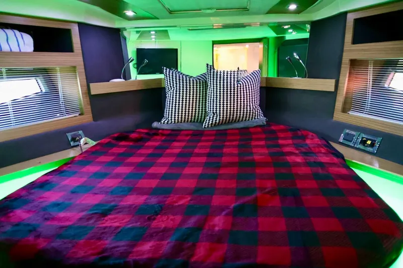 Slide: The Image of Luxurious cabin interior of 2014 Azimut 38 yacht with plaid bedding and modern lighting. - 20