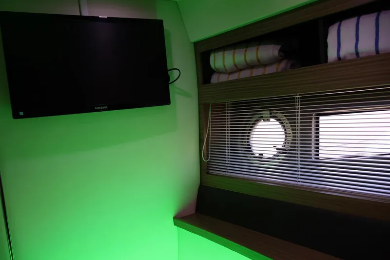 Slide: The Image of Interior of 2014 Azimut 38 yacht with TV, window blinds, and shelves. - 21