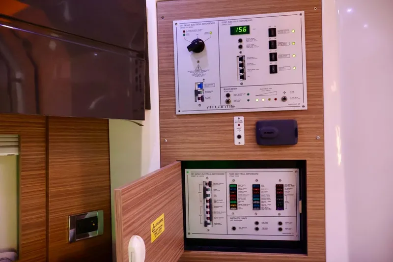 Slide: The Image of Control panel of a 2014 Azimut 38 yacht, featuring electrical switchboards. - 24