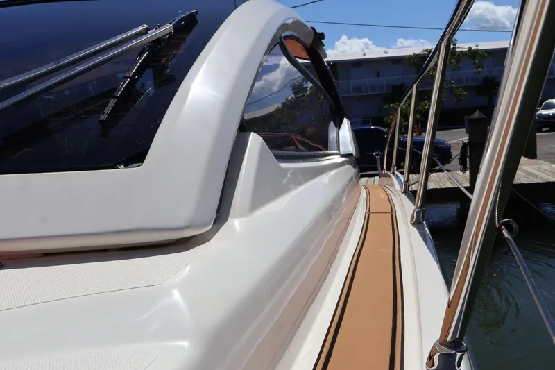 Slide: The Image of 2014 Azimut 38 yacht, sleek design, docked with polished railings and clear windows. - 31
