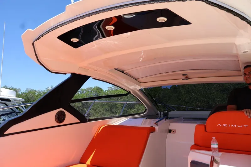 Slide: The Image of 2014 Azimut 38 yacht interior with orange seating and modern design elements. - 33