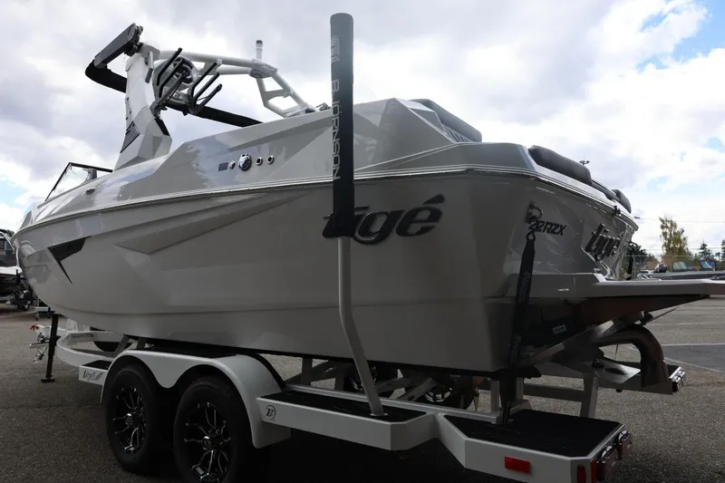 Slide: The Image of 2026 Tigé 22RZX boat on trailer, showcasing sleek design and modern features. - 10