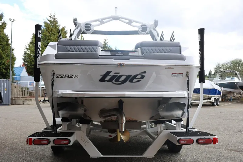 Slide: The Image of 2026 Tigé 22RZX boat rear view, showcasing sleek design and modern features. - 12