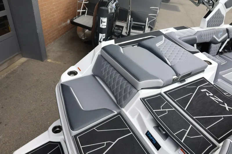Slide: The Image of 2026 Tigé 22RZX boat interior with gray seating and RZX branding. - 14