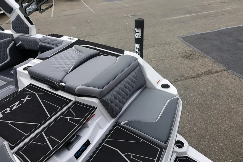 Slide: The Image of 2026 Tigé 22RZX boat interior with sleek gray seating and modern design. - 15