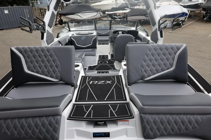 Slide: The Image of 2026 Tigé 22RZX boat interior with luxurious gray seating and modern design. - 16