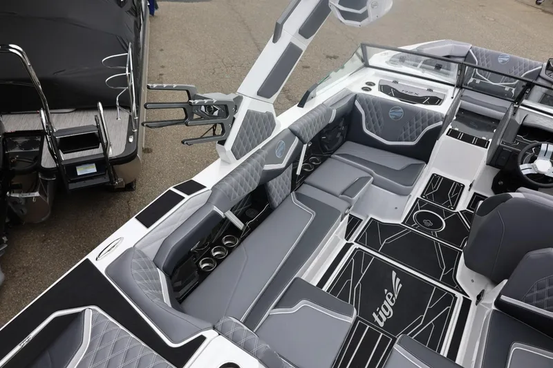Slide: The Image of 2026 Tigé 22RZX boat interior with sleek gray seating and modern design elements. - 21