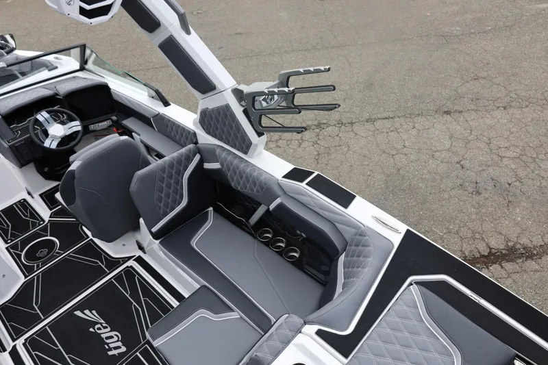 Slide: The Image of 2026 Tigé 22RZX boat interior with sleek gray seating and modern dashboard design. - 22