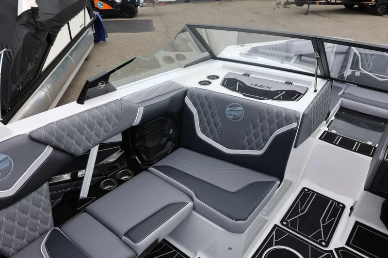 Slide: The Image of 2026 Tigé 22RZX boat interior with sleek gray seating and modern design elements. - 24
