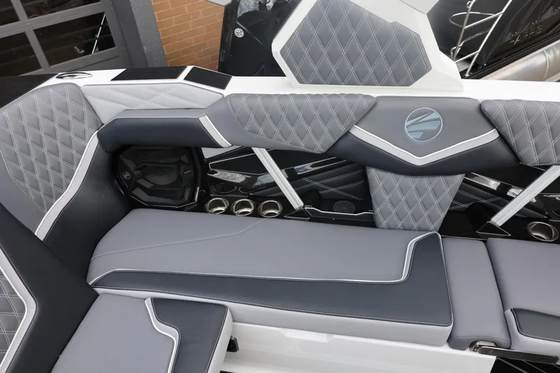 Slide: The Image of Luxurious interior of 2026 Tigé 22RZX boat with diamond-stitched upholstery and sleek design. - 25