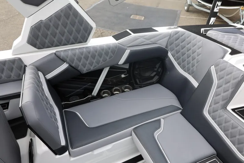 Slide: The Image of Luxurious interior of 2026 Tigé 22RZX boat with diamond-stitched seating and cup holders. - 28