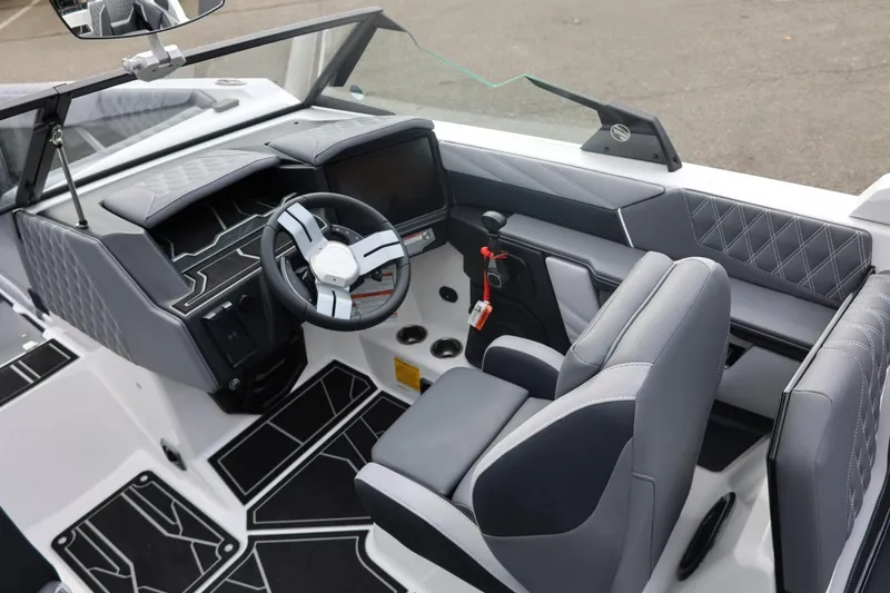 Slide: The Image of 2026 Tigé 22RZX boat interior with modern dashboard and sleek seating design. - 30