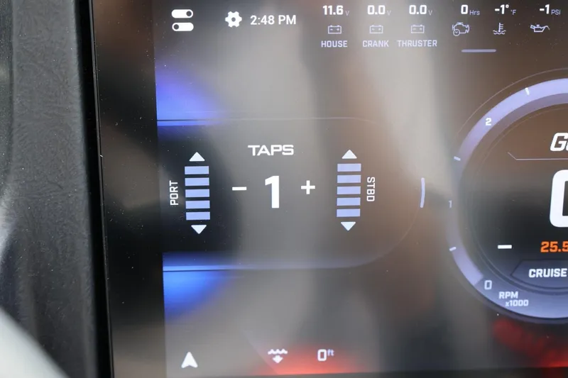 Slide: The Image of Dashboard display of 2026 Tigé 22RZX boat showing TAPS settings and gauges. - 37